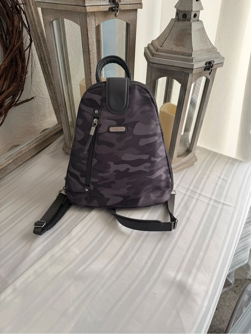 Baggallini MM Metro Backpack in a Dark Gray Camo print.